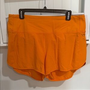 lululemon athletica Orange Athletic Shorts with Built-In Brief- 4” inseem